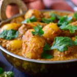 This spicy vegan potato curry is full on with flavour and easy to make with pantry staples. Fried potatoes are simmered in a spicy and savory tomato-cashew sauce infused with delicious, aromatic Indian spices. You''l be surprised by how tasty the humble potato can be!