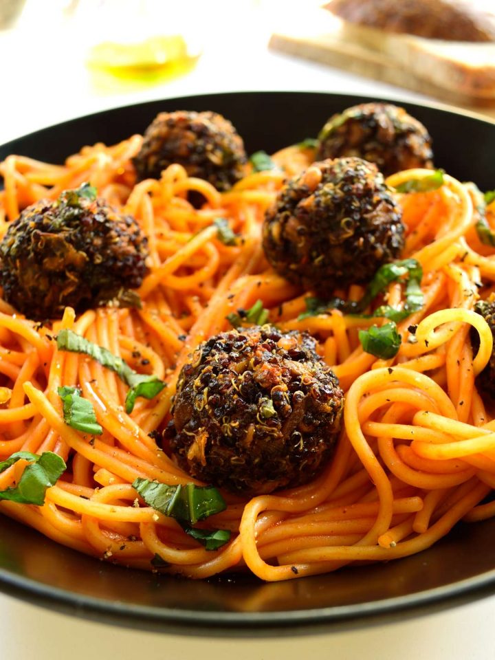 Spaghetti with quinoa meatballs is a hearty, satisfying dish. These vegan meatballs are super easy to make and are baked to make them light and healthy.
