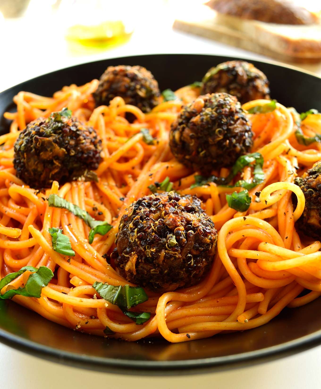 Spaghetti with quinoa meatballs is a hearty, satisfying dish. These vegan meatballs are super easy to make and are baked to make them light and healthy.