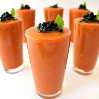 Fresh summertime gazpacho with balsamic caviar. Balsamic caviar is really easy to make and looks cool on any dish. Serve these individual portions at your next party and impress your guests!