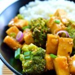 Orange and ginger glazed tofu is a quick and easy 30-minute weeknight meal. Crispy pan-fried tofu and fresh, crisp steamed broccoli in a sweet, ginger orange sauce. A healthy vegan/vegetarian meal.