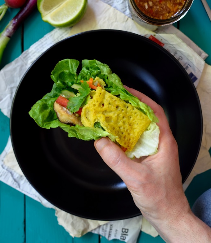 These vegan banh xeo (Vietnamese crepes) are so simple and delicious. Crispy crepes with a sweet hint of coconut stuffed with fresh veggies and wrapped in herbs and lettuce. A great vegan or vegetarian meal!