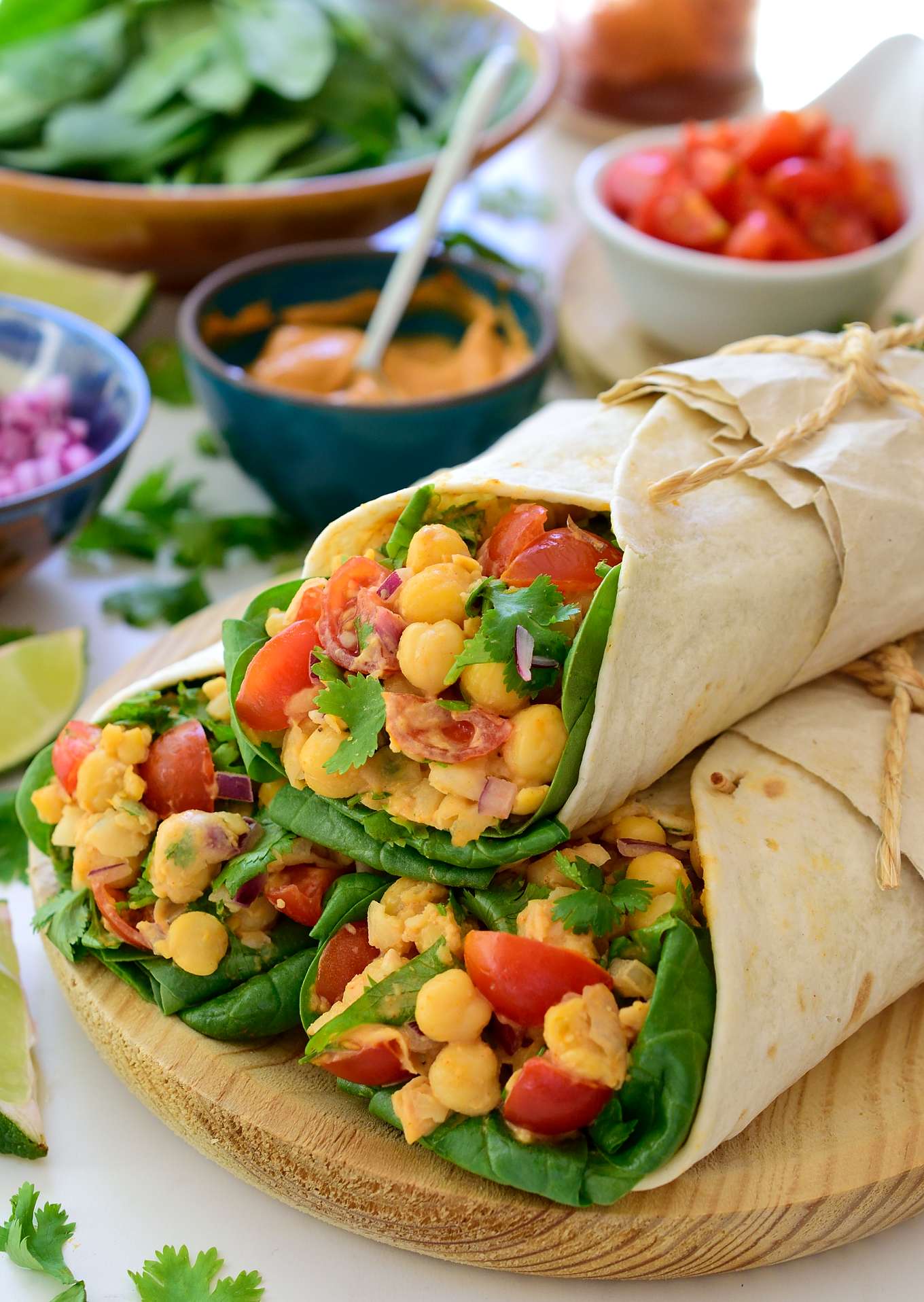 Vegan tacos with chickpeas are a super quick, easy and tasty taco recipe for lunch or dinner. Protein-packed chickpeas, juicy cherry tomatoes and fresh cilantro combine on a bed of crispy baby spinach leaves to make a simple and healthy taco filling. No need for waste, use the chickpea water to make a smoky vegan aquafaba mayonnaise flavoured with smoked paprika, cumin and lime. You’ll have these vegan tacos on the table and ready to eat in only 15 minutes!