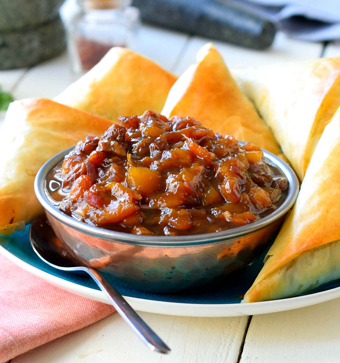 This vegan samosa recipe is a quick and easy version of traditional potato samosas with mango chutney. Save time and lighten up your samosas by wrapping them with phyllo dough and baking instead of frying. You get all the flavours of a samosa but without the grease and in half the time!