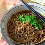 You don’t need to wait until New Year’s Eve to make this delicious toshikoshi soba recipe. This dish is extremely easy to make with just a simple and wonderful umami broth and nutty soba noodles. Sprinkle over some sesame seeds and chopped green onion for a bit of colour and crunch and you’ve got a lip-smacking, steaming bowl of soba noodle soup.
