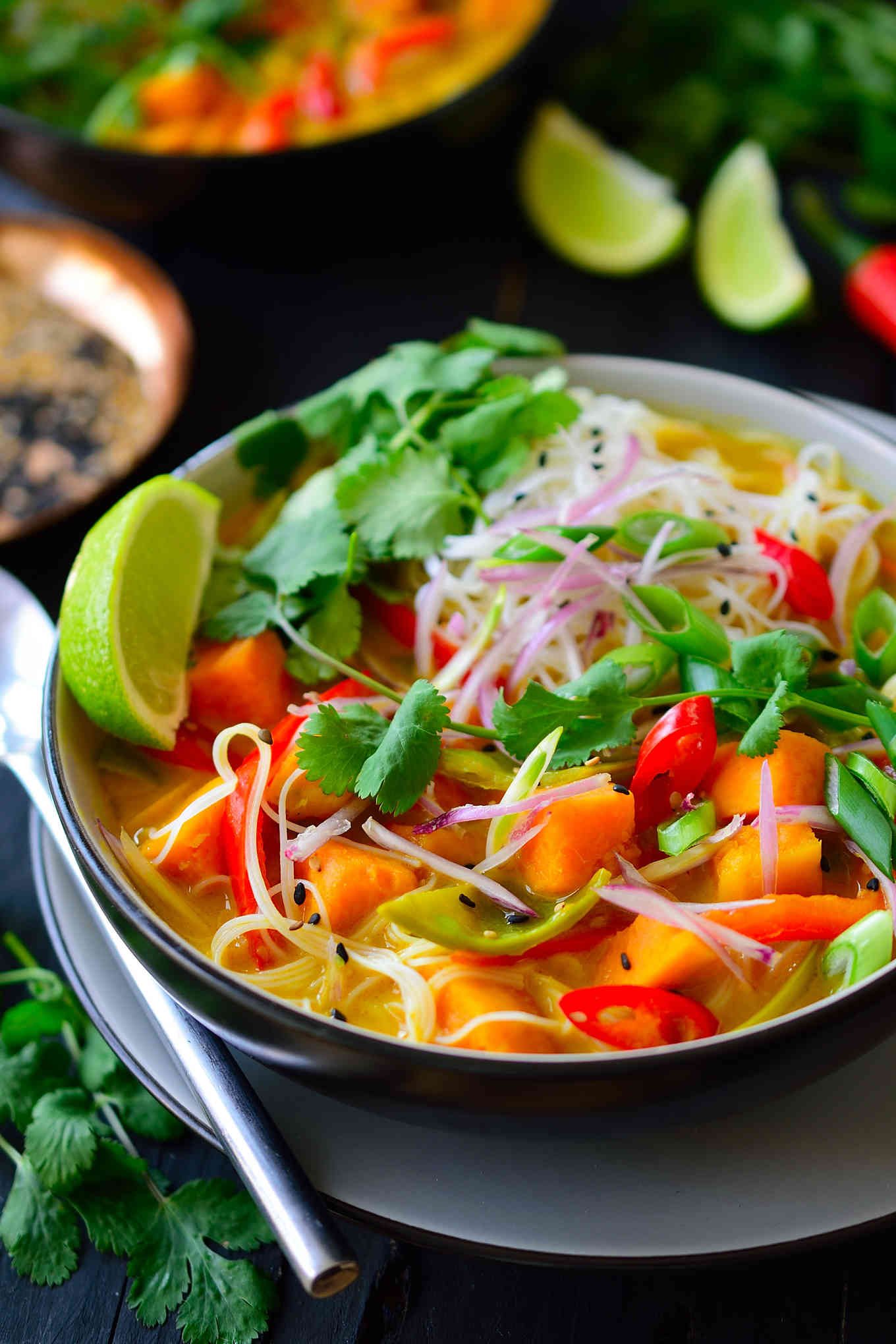 This vegetarian Thai soup is a hearty dish brimming with vegetables, rice noodles and herbs in a sweet, savoury and spicy coconut broth. It’s easy to make with a vegan store-bought curry paste and you won’t need any exotic ingredients to get this delicious soup on the table in just 20 minutes!