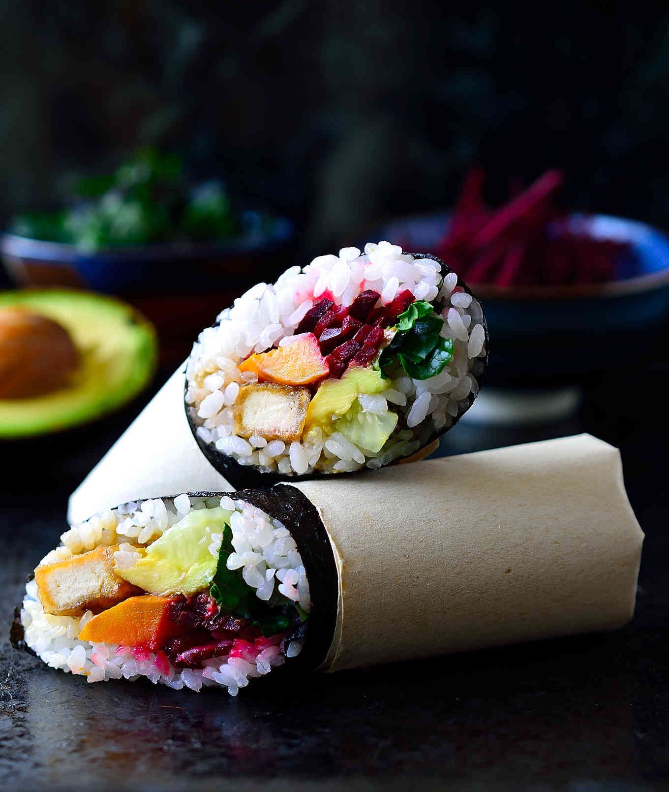This vegan sushi burrito recipe is the marriage between two great foods in one perfect hand-held package. They’re easy to make, packed with flavour and super adaptable to whatever fillings you choose. I’ve stuffed sushi burritos with a rainbow of vegetables and deliciously crispy fried teriyaki tofu.